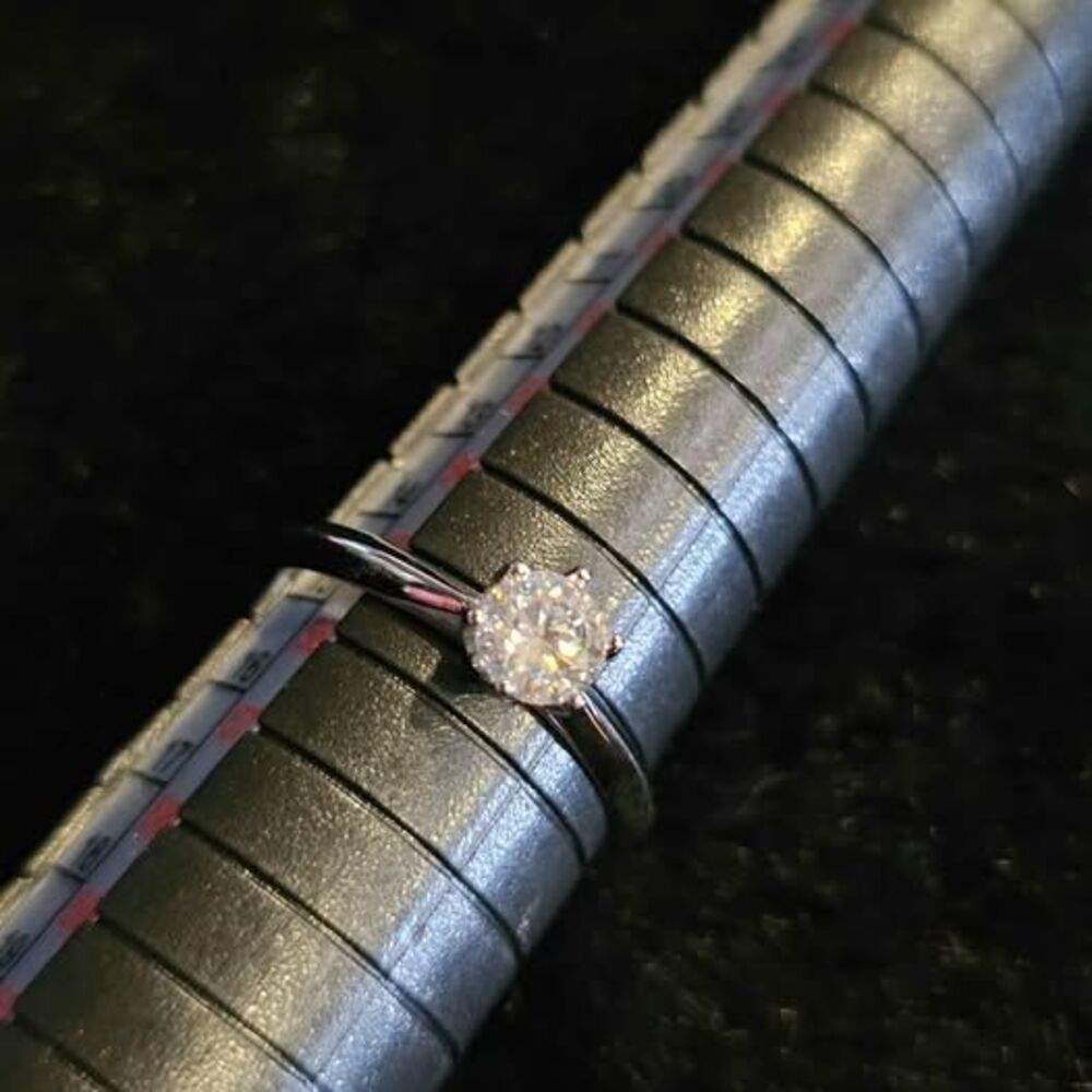 .5CTW Moissanite Solitaire in sterling silver. Size is adjustable!